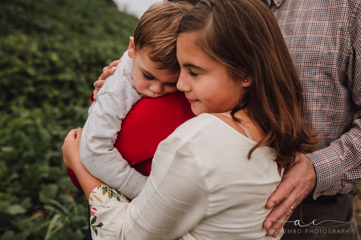 sister and brother embracing